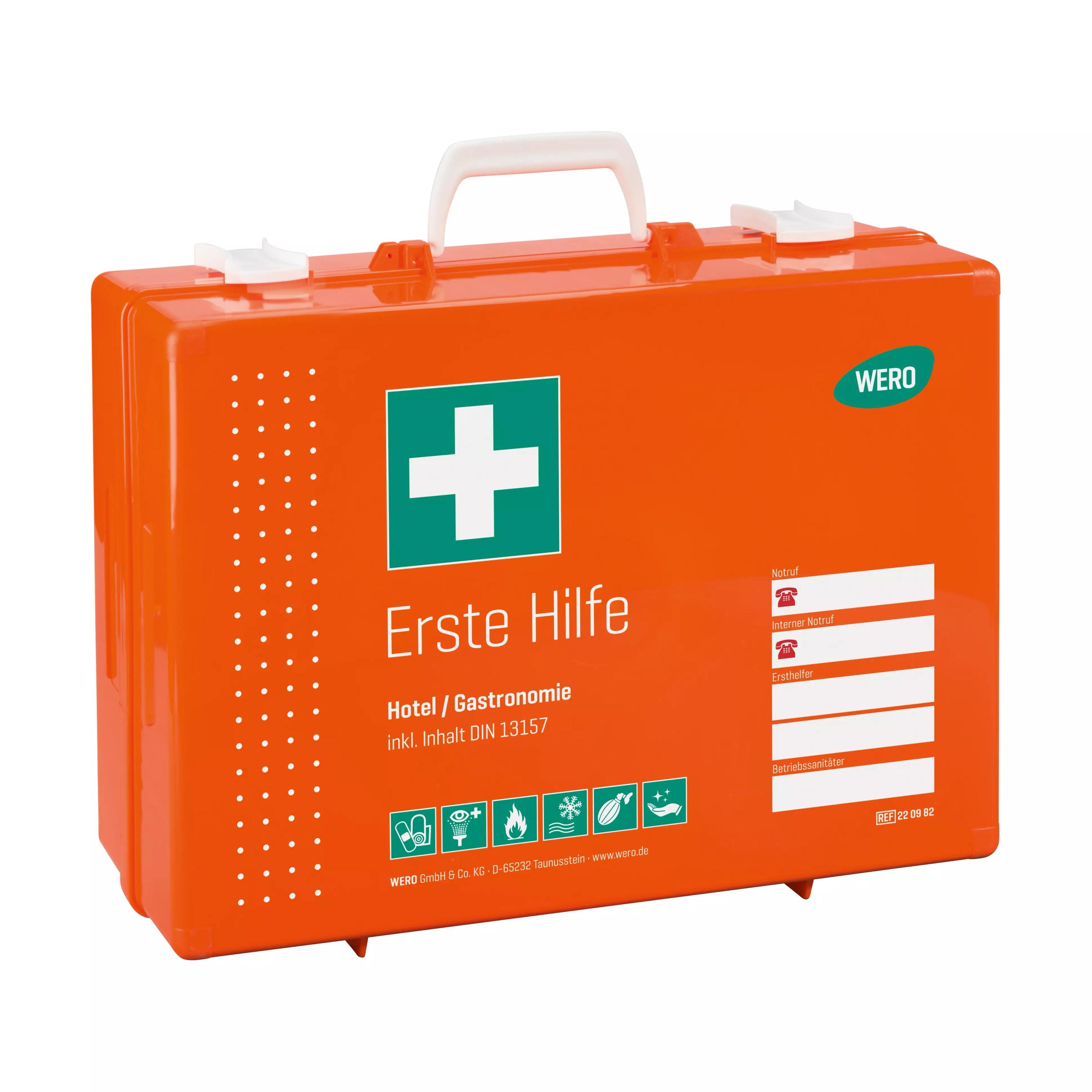 Ein orangefarbener Werotop® 450 Erste Hilfe Koffer Gastronomie / Hotel DIN 13157 mit weißem Griff und grünem Erste-Hilfe-Kreuz auf dem Etikett.