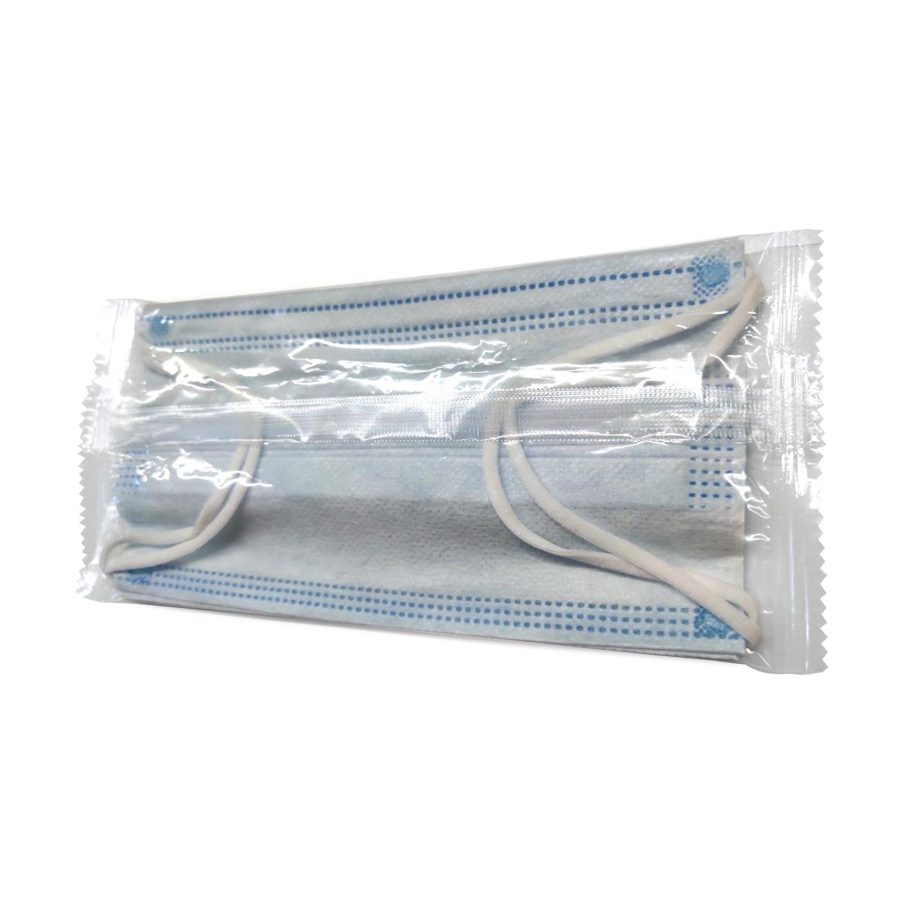 Eine einzelne WERO Mund-Nasen-Schutz Maske, 3-lagig, blau mit weißen Punkten und elastischem Band, liegt gefaltet in einer transparenten Blisterverpackung.