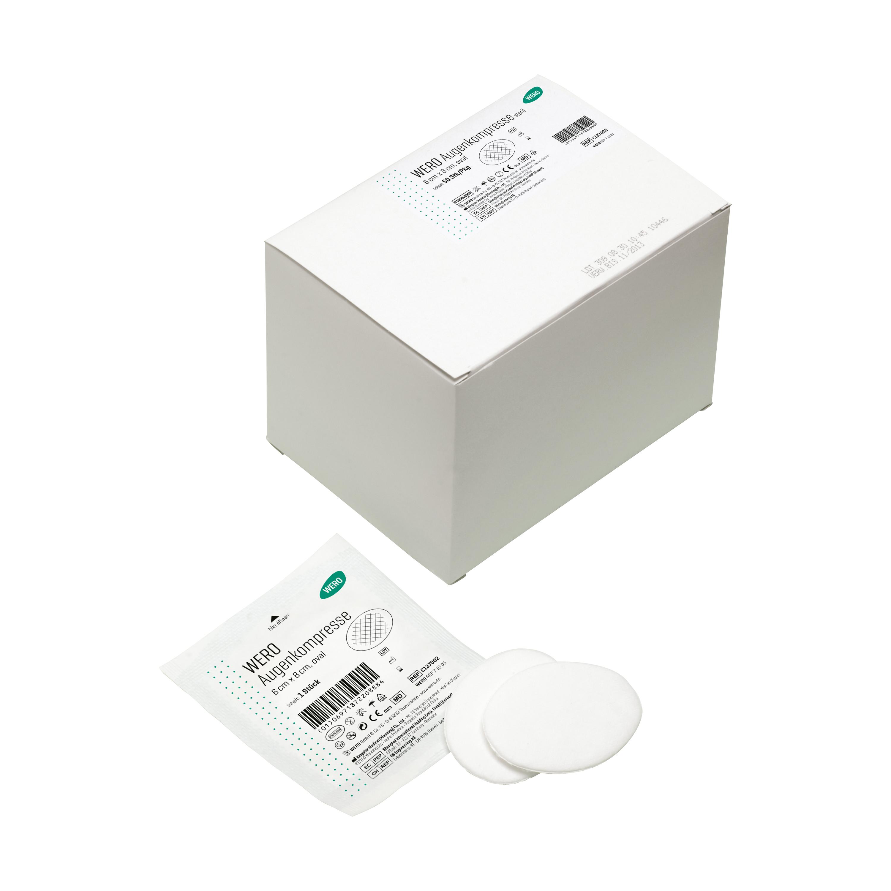 Zwei weiße, ovale WERO Augenkompressen, steril, aus weicher Baumwollwatte mit hoher Polsterwirkung, liegen vor einer Etikettbox.
