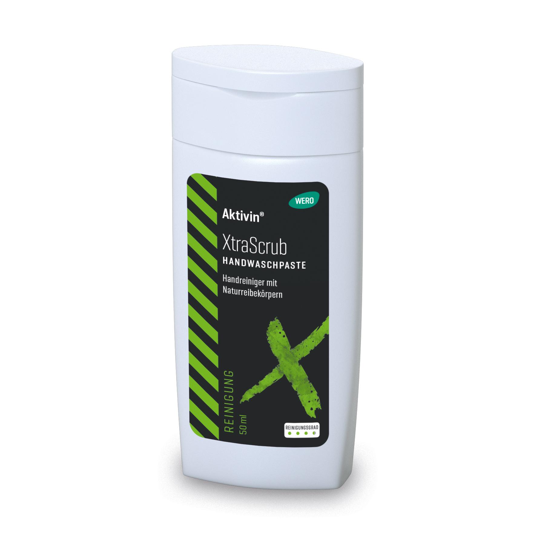 Weiße Flasche Hautreinigung Aktivin® XtraScrub - Probiergröße, 50 ml, mit Flip-Top-Deckel, schwarzem Etikett und grünen Akzenten, 50 ml.