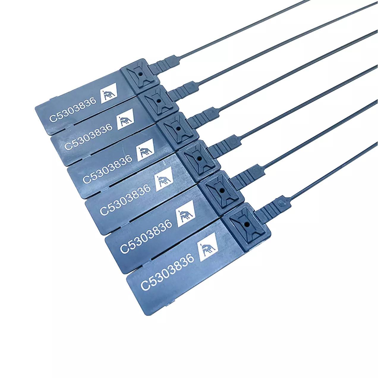 Mehrere Detektierbare Durchziehplomben, schwarz und rechteckig mit weißer Seriennummer und Logo, nebeneinander aufgereiht.