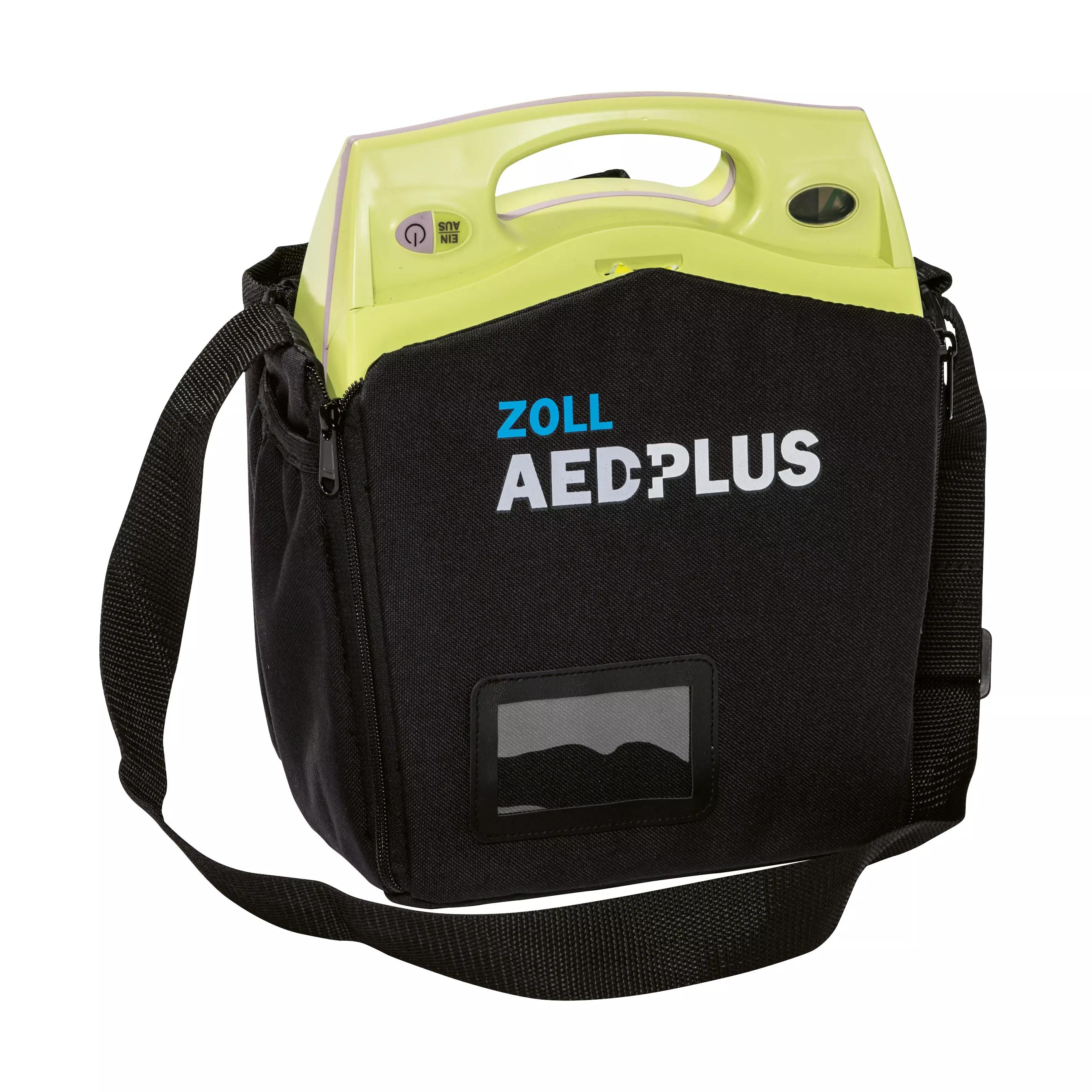 Die ZOLL AED Plus Soft-Tasche, leer, steht aufrecht und zeigt ein Sichtfenster, durch das das grüne AED-Gerät zu erkennen ist.