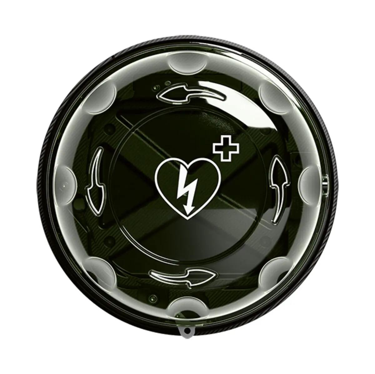 Tragbares AED-Gerät mit weißem Herzsymbol und Blitz, Pluszeichen und seitlichem Bedienknopf unter transparenter Abdeckung mit schwarzem Rahmen.