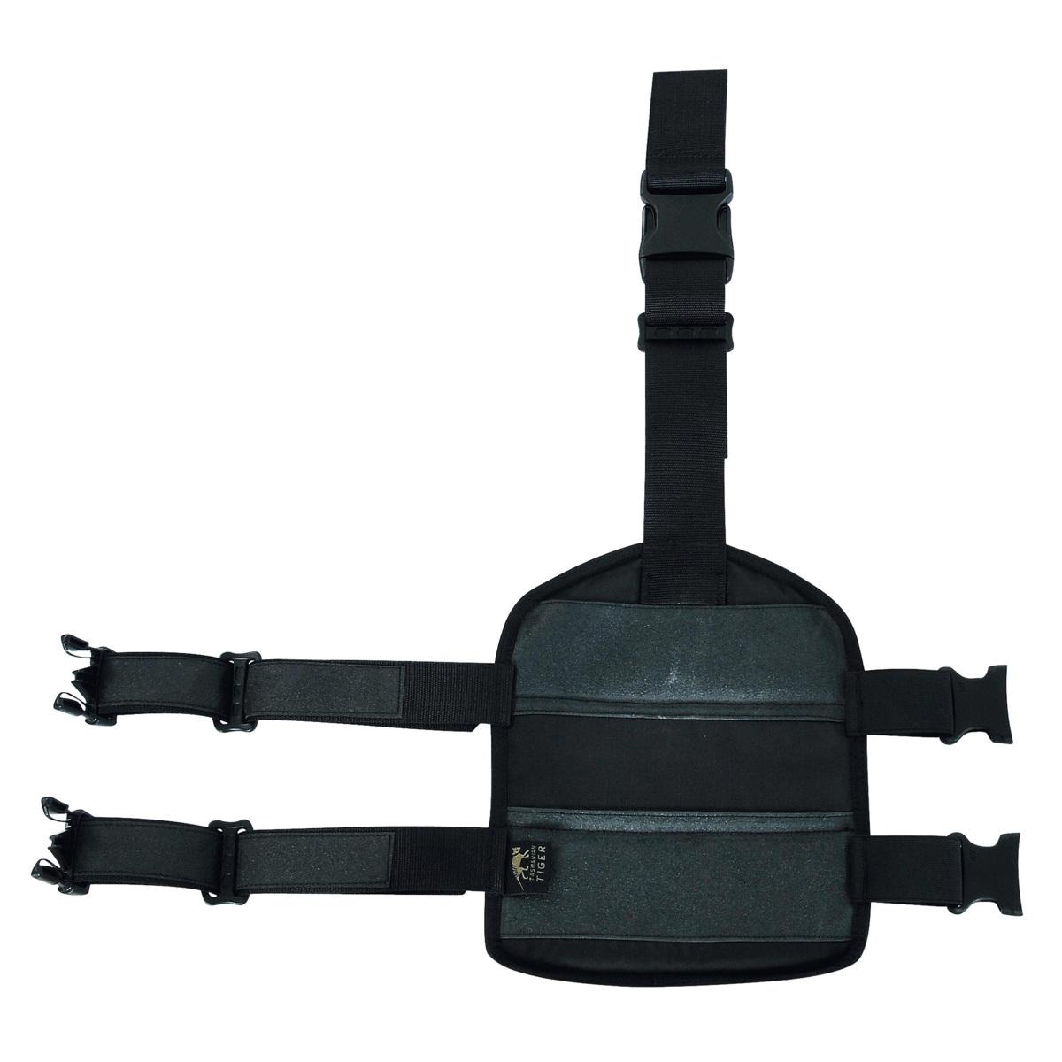 Schwarze TT Leg Base Beinplatte mit MOLLE-System, zwei seitlichen verstellbaren Riemen, mittigem Verschluss und robustem, strapazierfähigem Material.