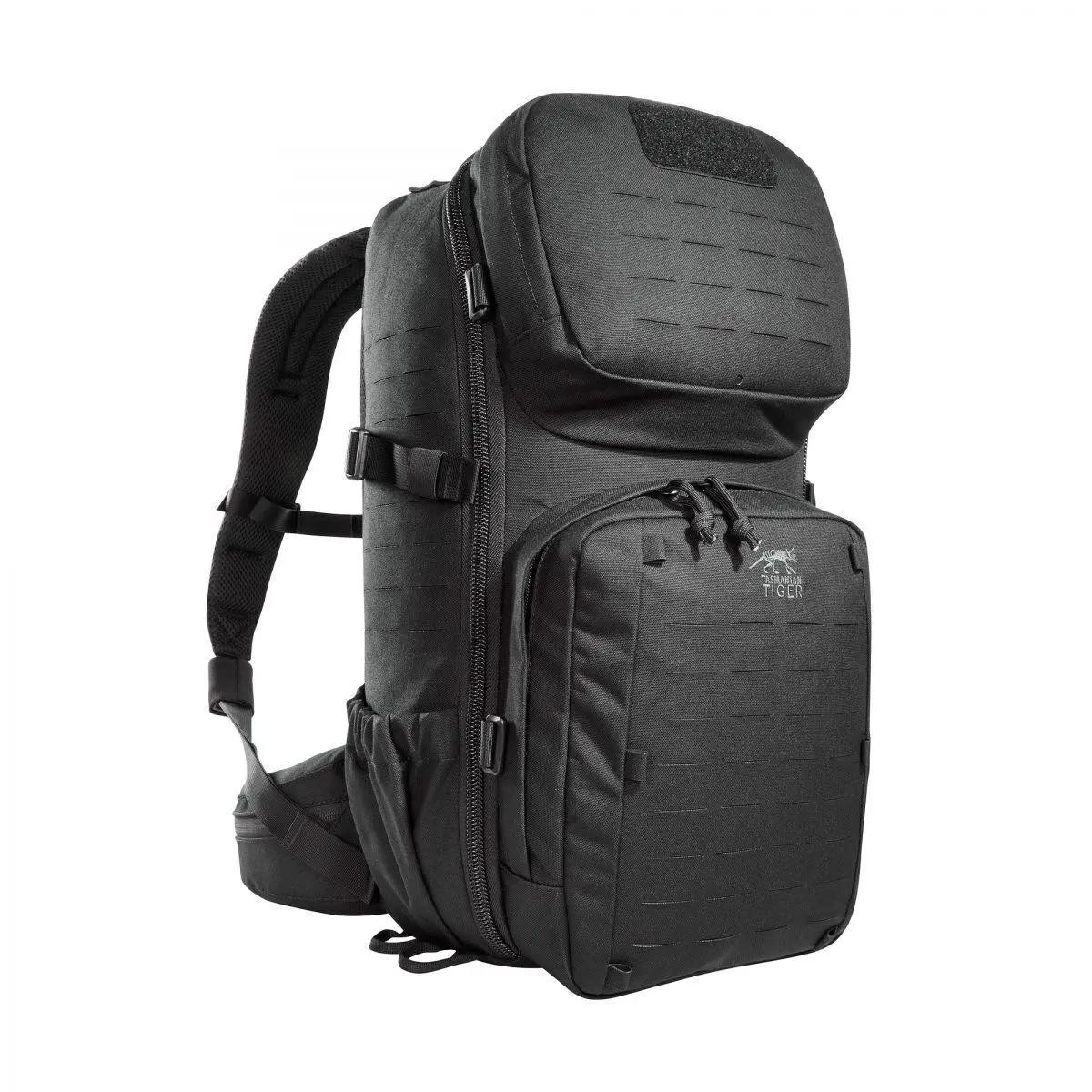Schwarzer TT Modular Combat Pack Rucksack mit mehreren Reißverschlussfächern, Lasercut-MOLLE-Front, elastischen Seitentaschen und abnehmbaren Gurten.