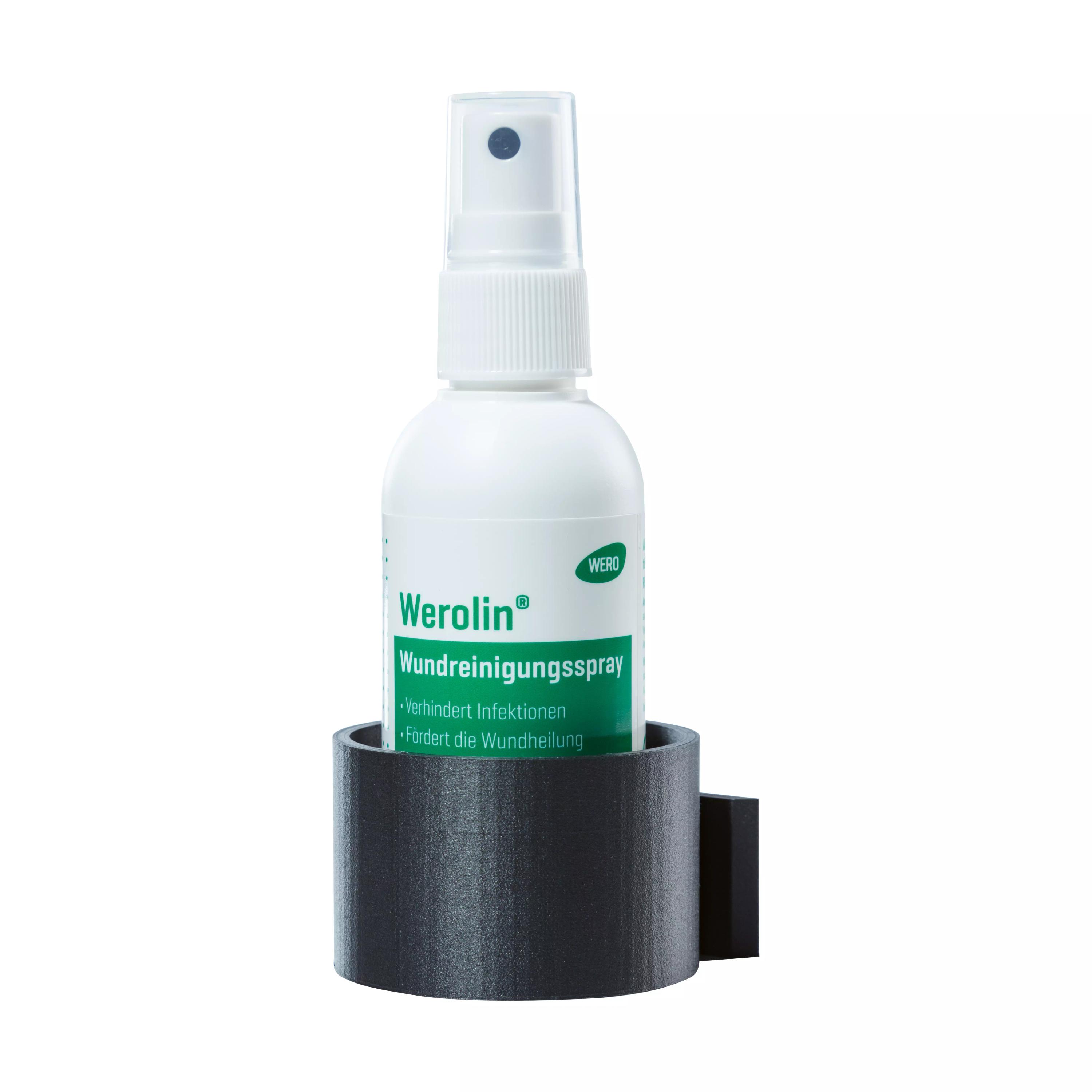 Das WERO Halter für Werolin® Wundreinigungsspray enthält eine anthrazitfarbene Halterung mit zwei Stegen und integrierter Sprühflasche.