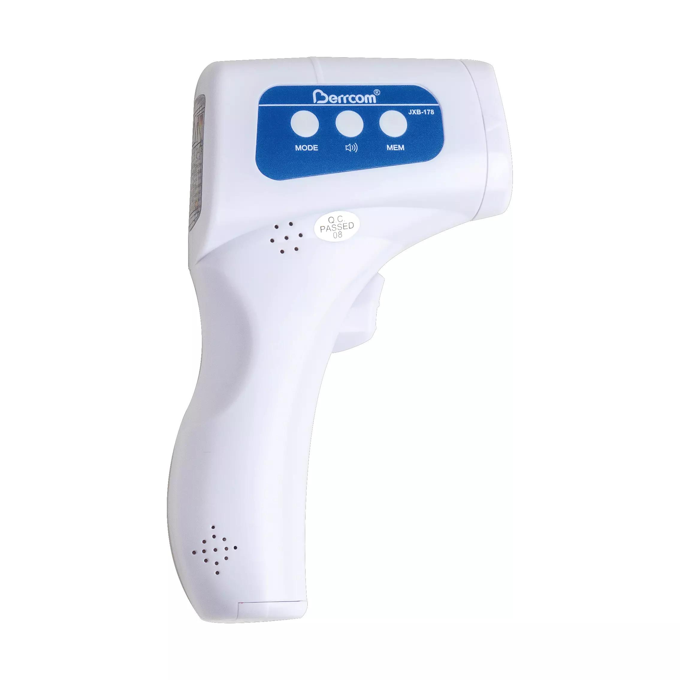 Ein Berührungsloses Infrarot-Thermometer Berrcom JXB-178 mit blauem Kopf, zwei Tasten und strukturiertem Griff steht aufrecht im Fokus.