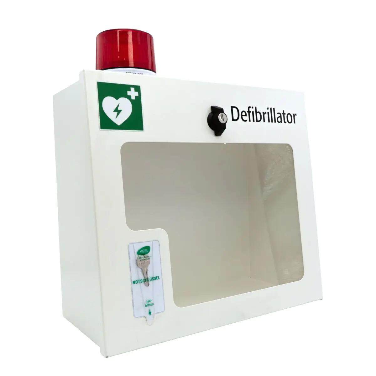AED-Wandschrank (gebraucht) - mit Alarmfunktion (Sirene & Leuchte) mit Sichtfenster, grünem AED-Symbol, rotem Warnlicht und seitlicher Zahlen-Tastatur.
