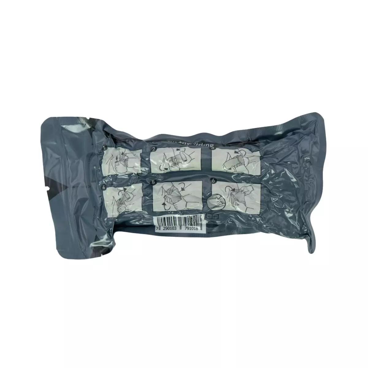 Eine einzelne Packung Die Emergency Bandage®, das Original - Oliv, 15 cm mit sechs illustrierten Anwendungsschritten und sichtbarem Aufhängepunkt.