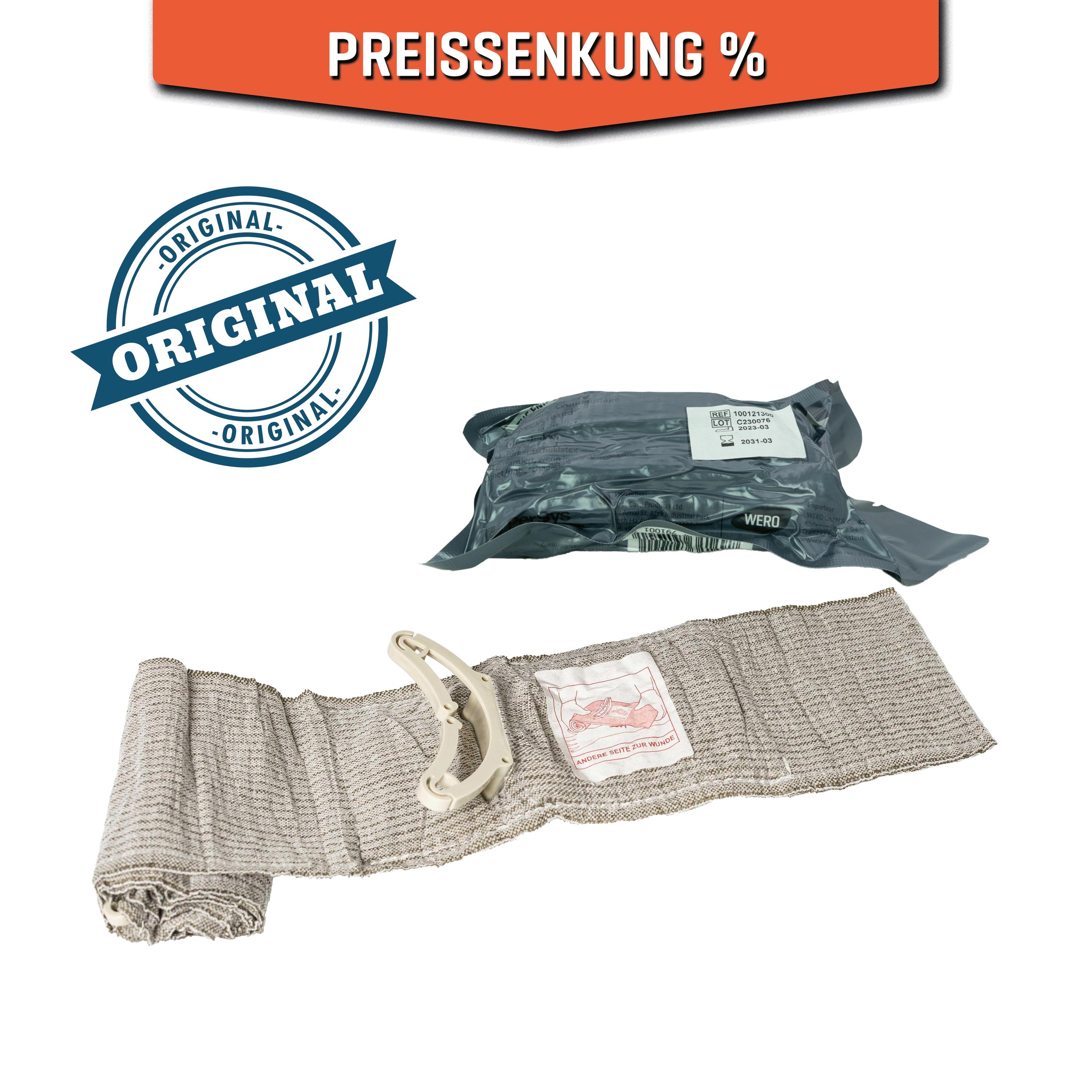 Eine aufgerollte Die Emergency Bandage®, das ORIGINAL - Oliv, 10 cm mit weißem Griff und rotem Etikett, daneben eine verschlossene olivfarbene Verpackung.