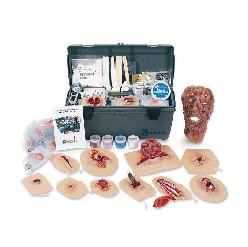 Das Erler-Zimmer Xtreme 2 Trauma Moulage Kit zeigt geöffnete Box mit Moulagen, Schminkzubehör und Werkzeugen sowie modelliertem Kopf für Trainingszwecke.
