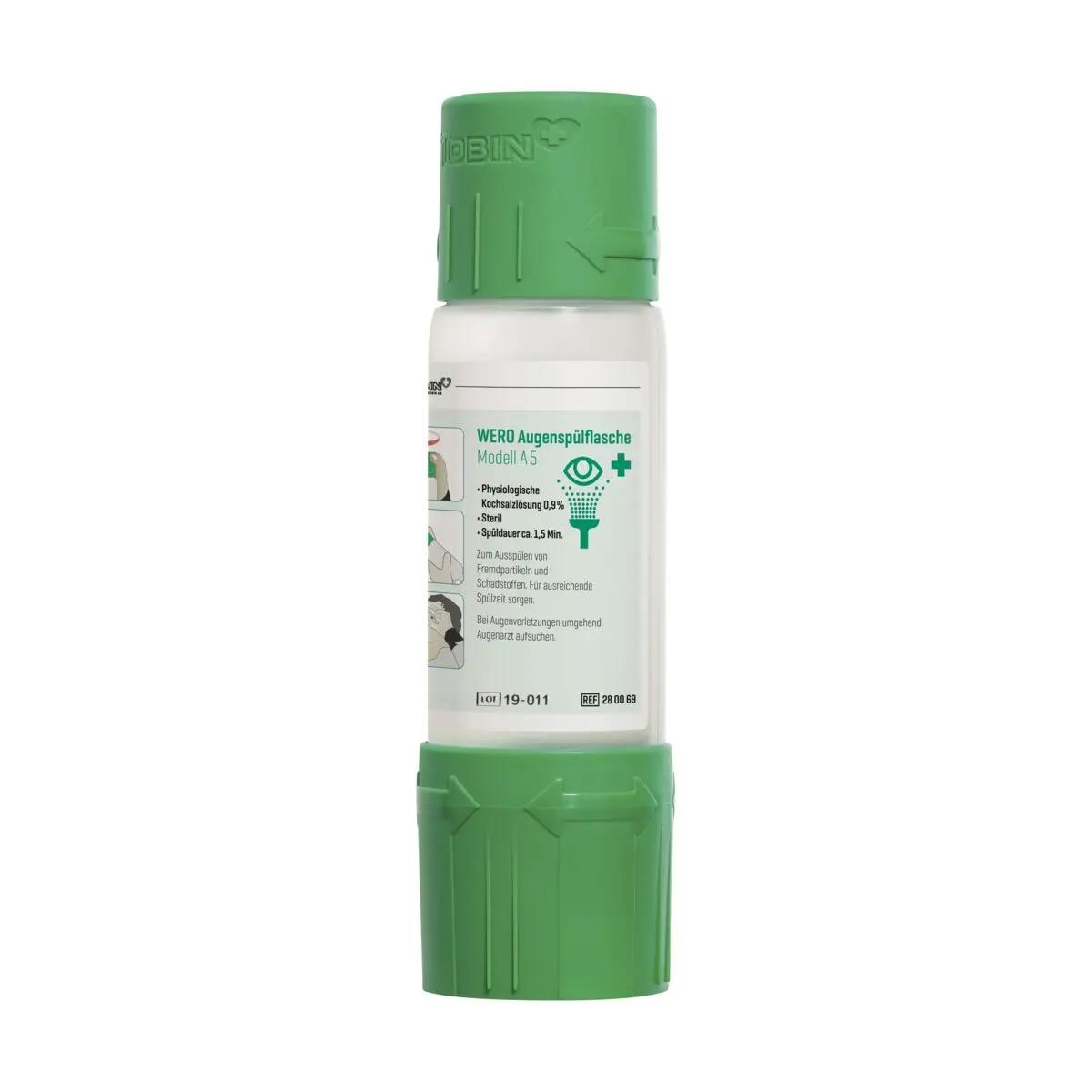 Weiße WERO Augenspülflasche Modell A 5 mit grün geriffeltem Deckel und mehrsprachigem Etikett, steht aufrecht, Volumenangabe 19.011 ml.