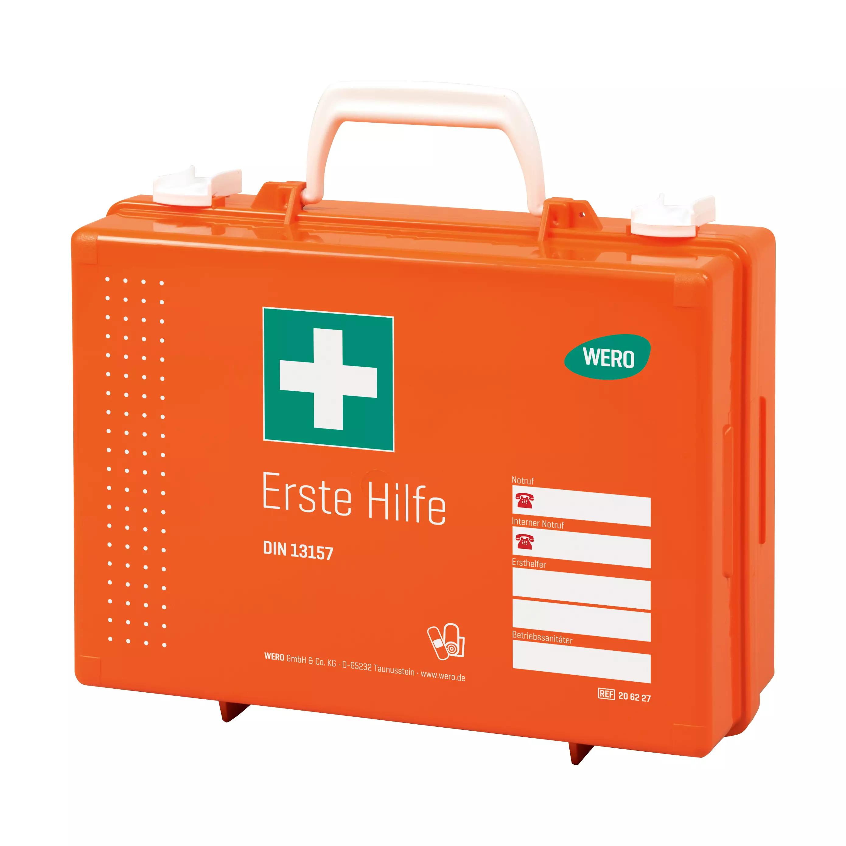 Orangefarbener Werotop® 350 Erste Hilfe Koffer mit grünem Kreuz, weißem WERO-Aufkleber und mehreren Erste-Hilfe-Beschriftungen nach DIN 13157.