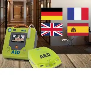 Automatisierter externer Defibrillator in Grün mit Display und Symbolen für Deutsch, Französisch, Englisch, Spanisch sowie dem Kürzel „uvm“.