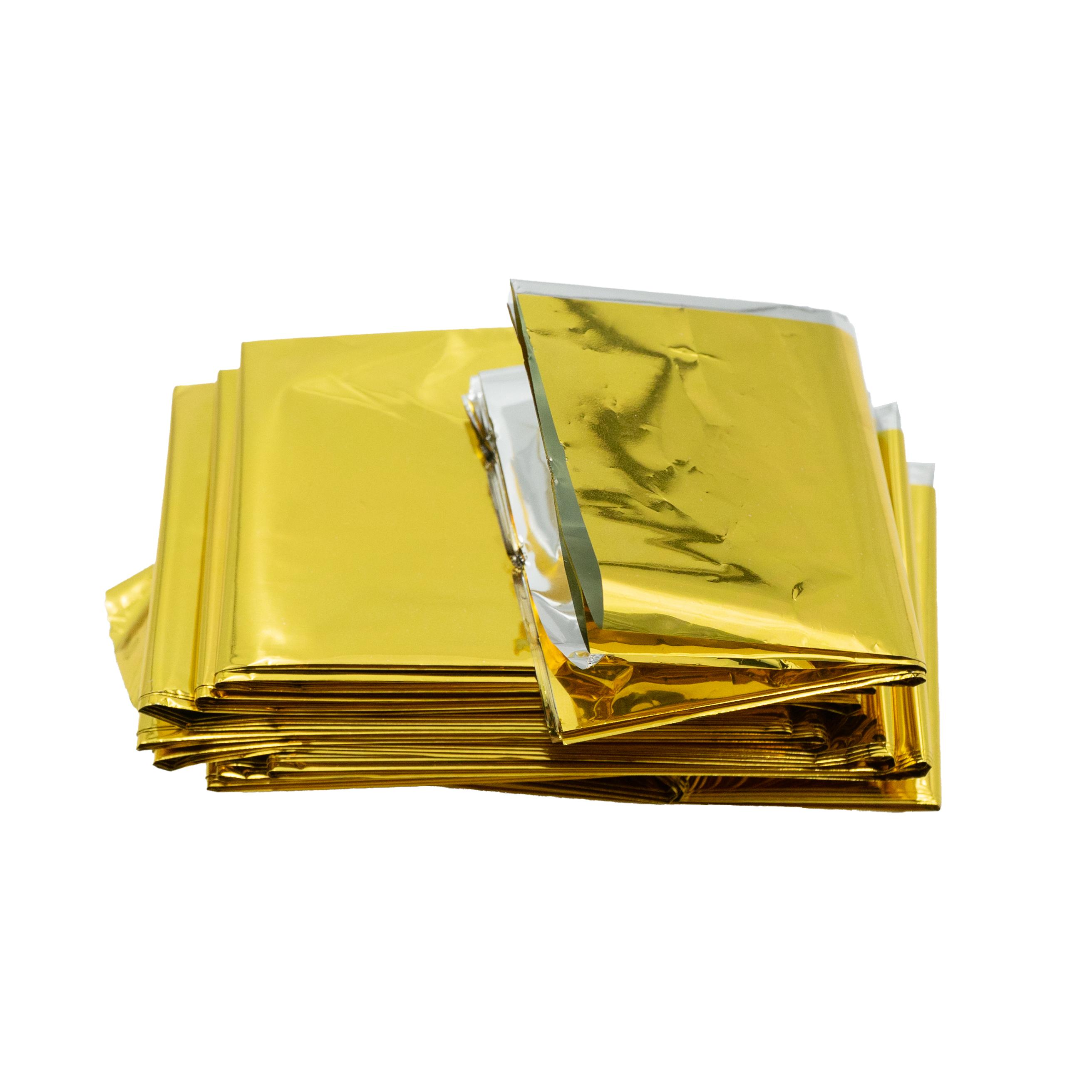 Mehrere übereinanderliegende, rechteckige WERO Rettungsdecke Pakete mit glänzender, goldfarbener Folienoberfläche, regelmäßig gestapelt.