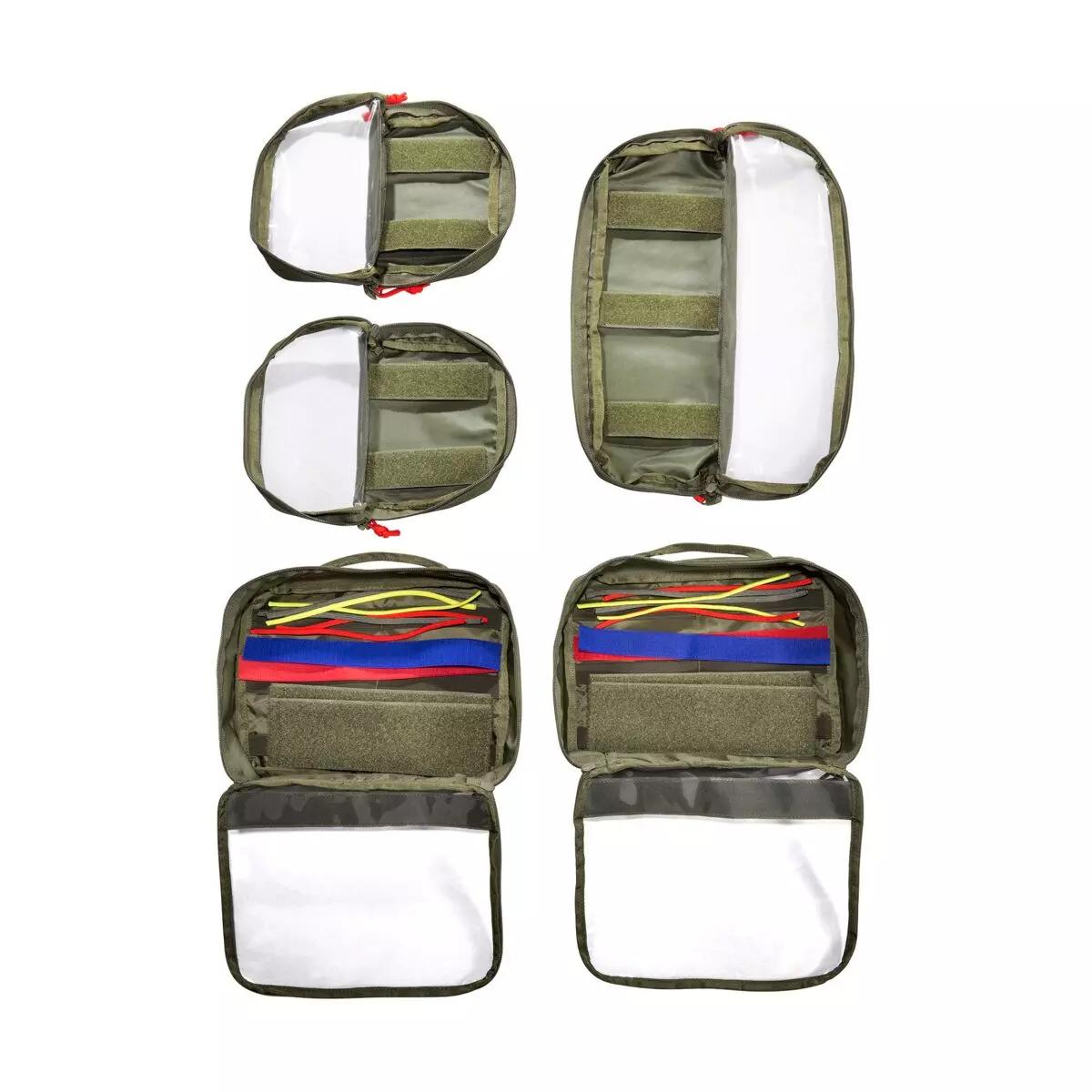 Sechs TT Modular Medic Insert 30 VL Sets mit Klarsichtdeckel, elastischen Bändern und verschiedenfarbigen Klettstreifen, bestückt mit medizinischem Zubehör.