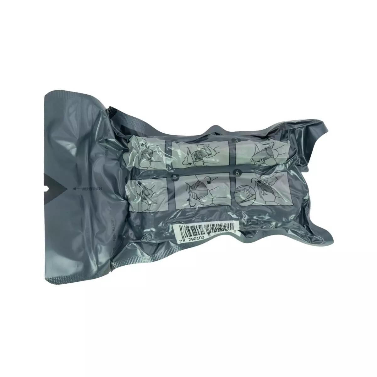 Dunkeloliver Standbeutel Die Emergency Bandage®, das ORIGINAL – Oliv, 10 cm mit Sichtfenster, Barcode und teilweise sichtbaren Anwendungsgrafiken.