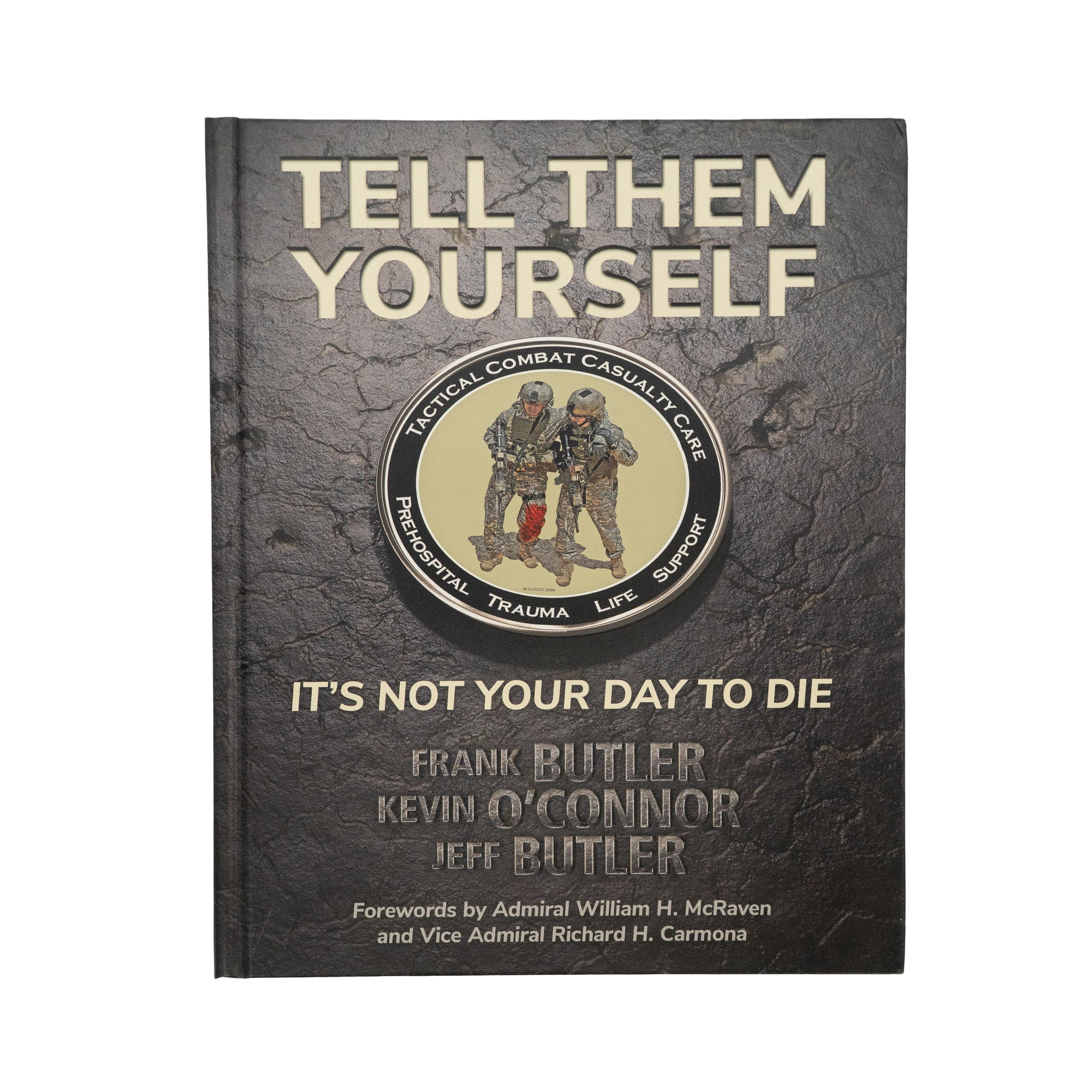 Das Buch „Buch: Tell Them Yourself - It's Not Your Day to Die“ zeigt ein zentrales Emblem mit zwei Soldaten in voller Ausrüstung und klaren Militärbezug auf schwarzem Cover.