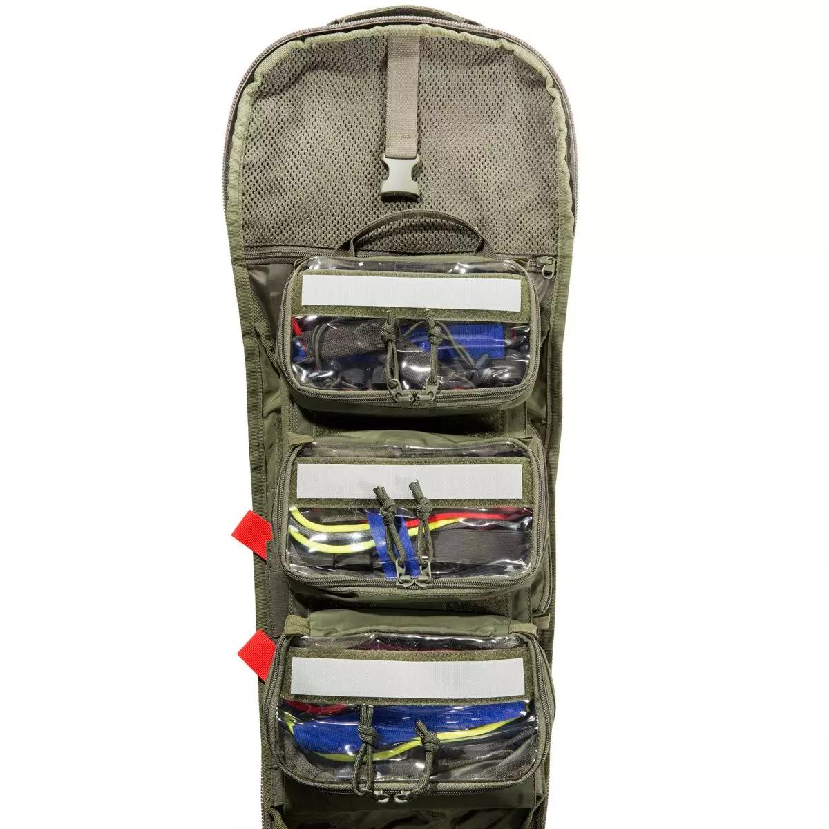 Ein TT Modular Medic Insert 30 VL mit vier durchsichtigen Fächern und grüner Trageschlaufe, ideal zur flexiblen Organisation von medizinischem Zubehör.