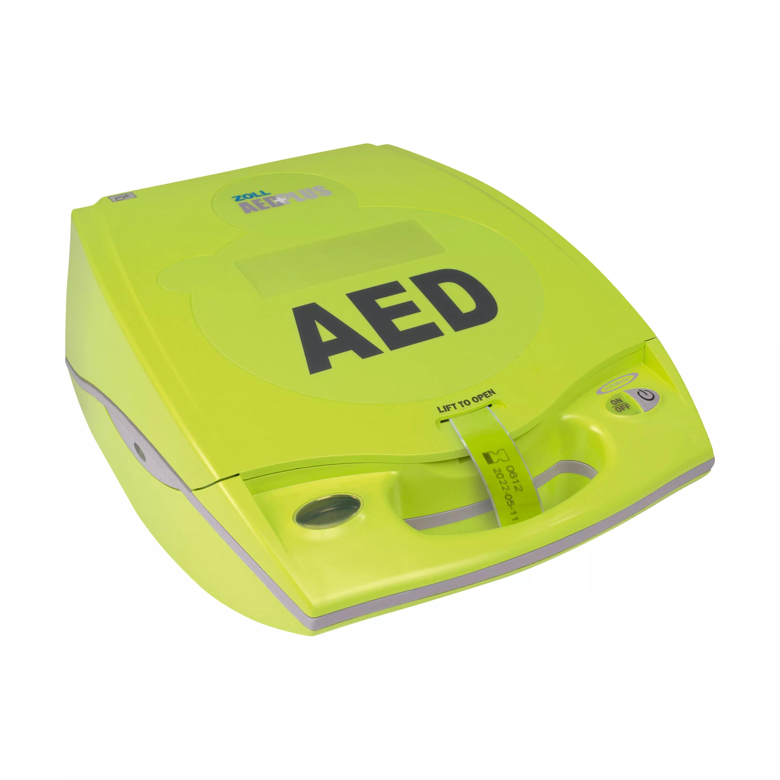 Ein ZOLL AED Plus ohne Zubehör - Halbautomat mit gelbem Gehäuse, schwarzem AED-Schriftzug, grünem Tragegurt und grauem Griff.