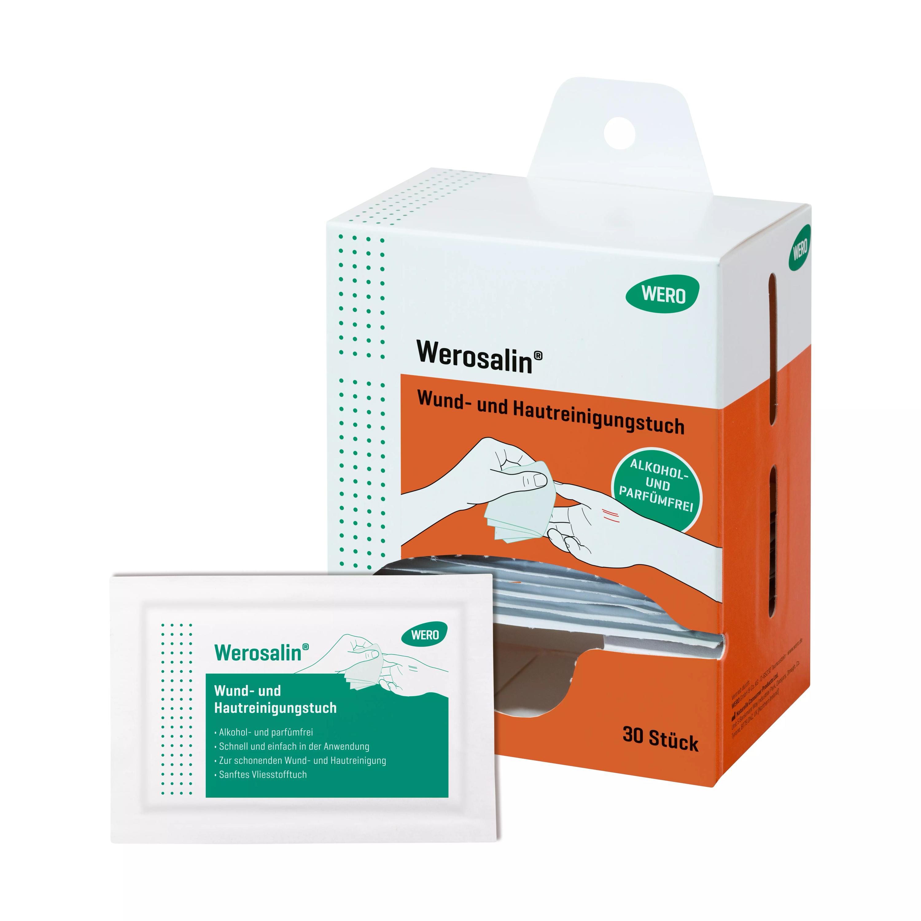 Weiße Box mit orangefarbener Banderole, grünem Werosalin® Wund- und Hautreinigungstuch-Label und Illustration zur Reinigung einer Hand