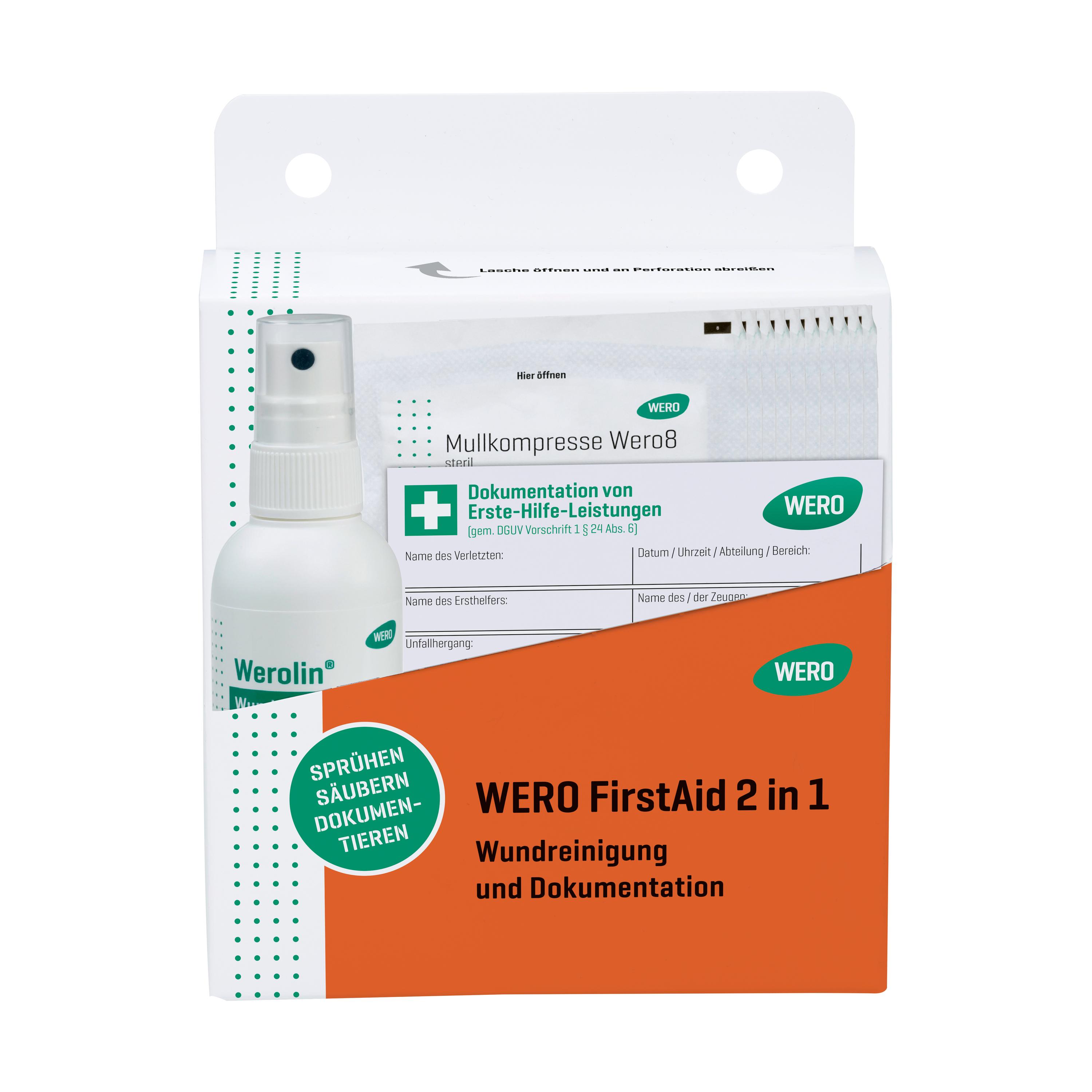 Weiße Box mit grünem Akzent von WERO FirstAid 2 in 1, enthält Spray, saugfähige Pads und Anleitung zur Wundreinigung und Dokumentation.