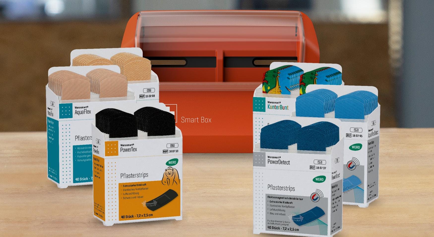 Abbildung der WERO Smart Box. Im Vordergrund stehen verschiedene, passende Pflastereinsätze von WERO.