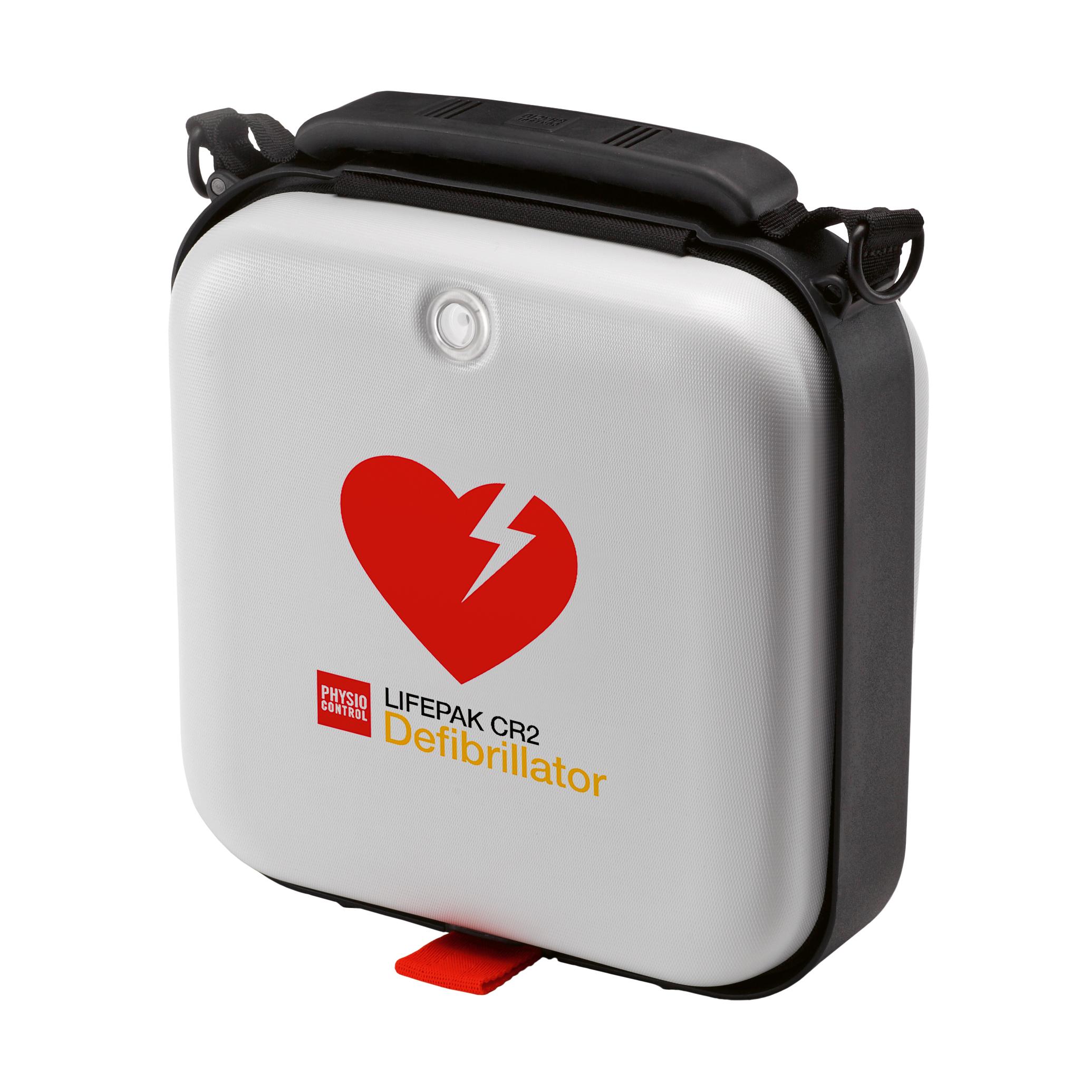 Graue Tragetasche Hard-Shell für den Defibrillator LIFEPAK CR2 mit rotem Herz-Logo, schwarzem Griff, Schultergurt und rotem Zipper.