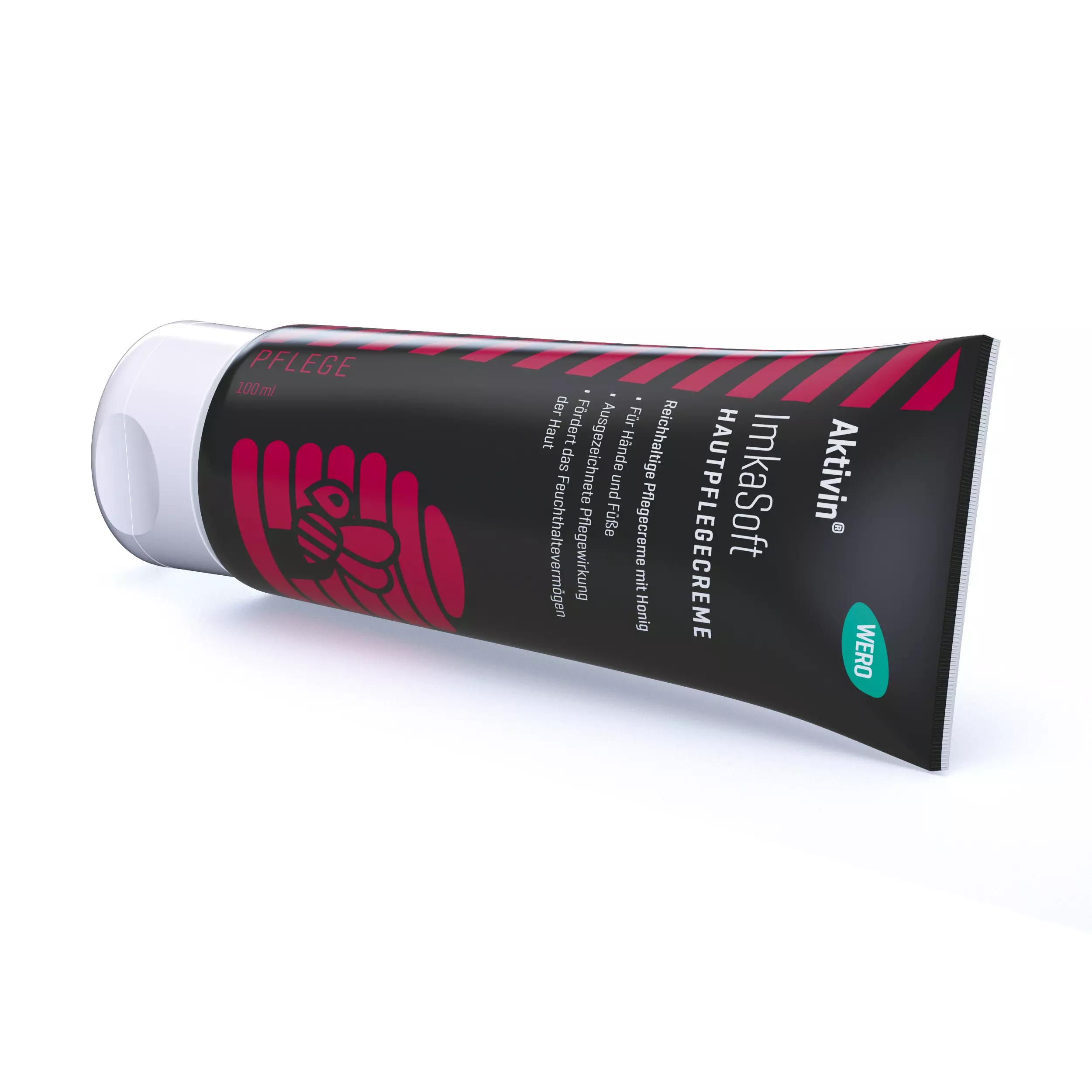 Schwarze Tube Hautpflegecreme Aktivin® ImkaSoft - 100 ml mit silberner Kappe, rotem Streifen, Bienenmotiv und Hinweis auf Honig für beanspruchte Haut.