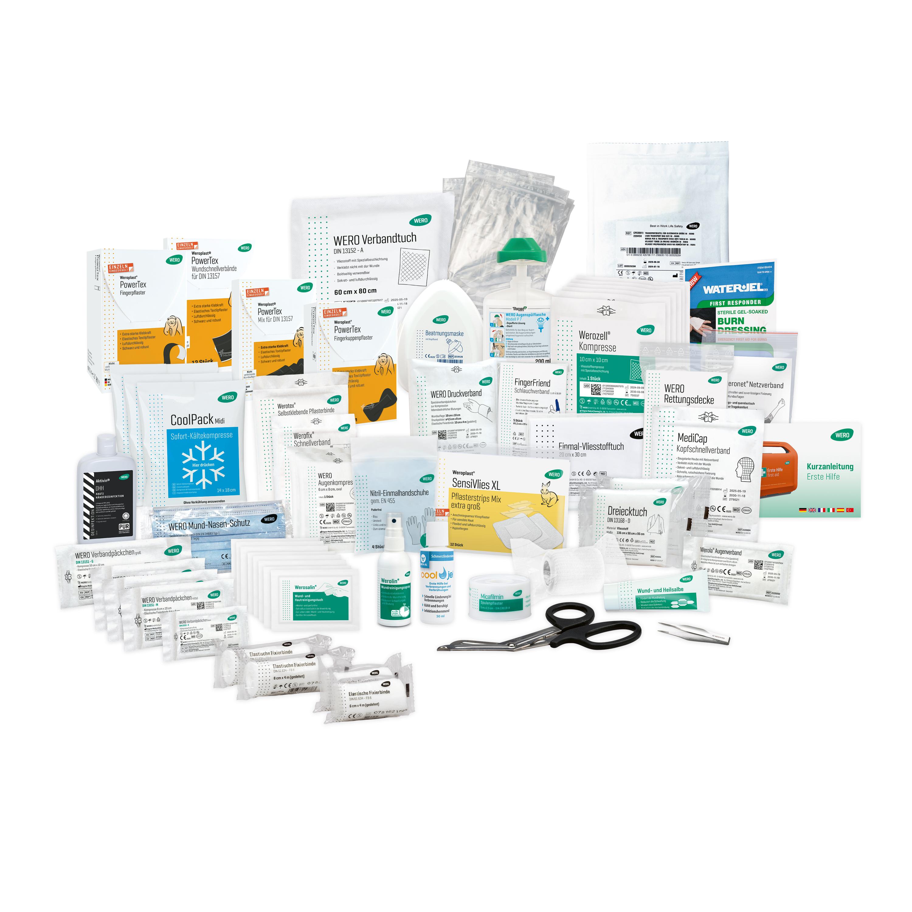 Verschiedenste medizinische Artikel der Füllung für Erste Hilfe Koffer Logistik / Versand, inklusive Schere, Flaschen und Verbandpäckchen, ordentlich angeordnet.