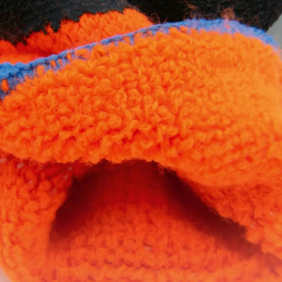 Kälteschutzhandschuh WERO Frosty in Orange mit aufgerauter Latexbeschichtung, rutschsicherem Grip und optimalem Kälteschutz, paarweise abgebildet.