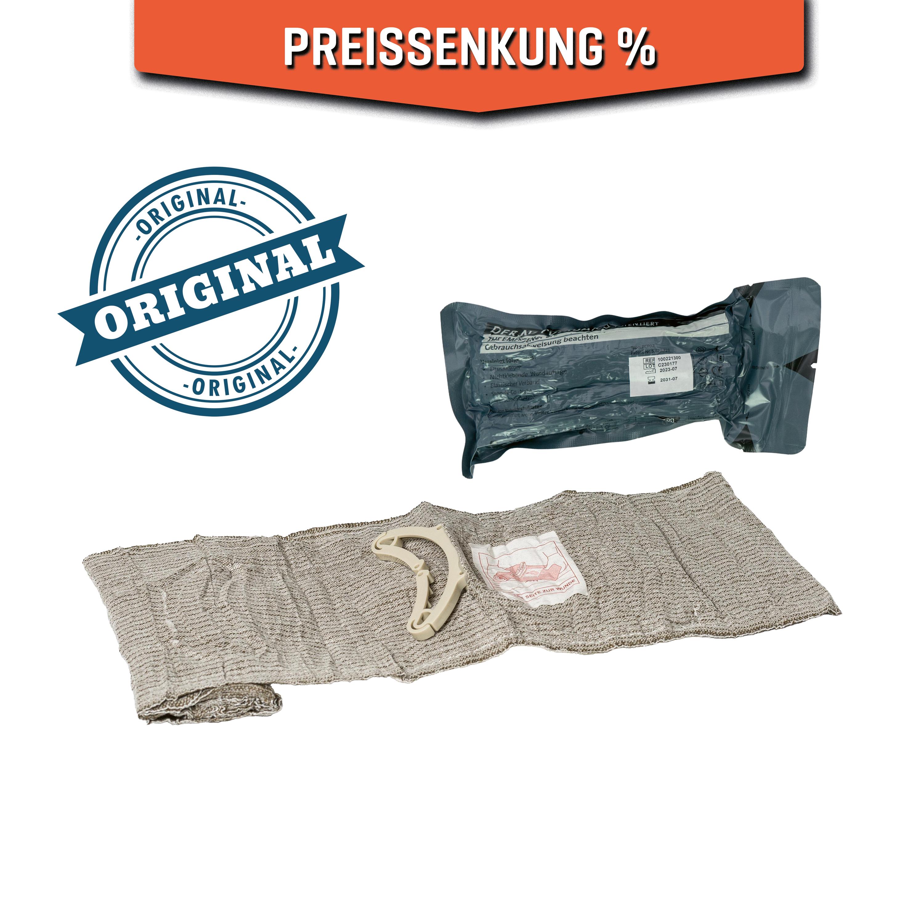 Eine aufgerollte Emergency Bandage®, das Original - Oliv, 15 cm, mit Clip und separat verpacktem Ersatzverband, zur schnellen Versorgung starker Blutungen.