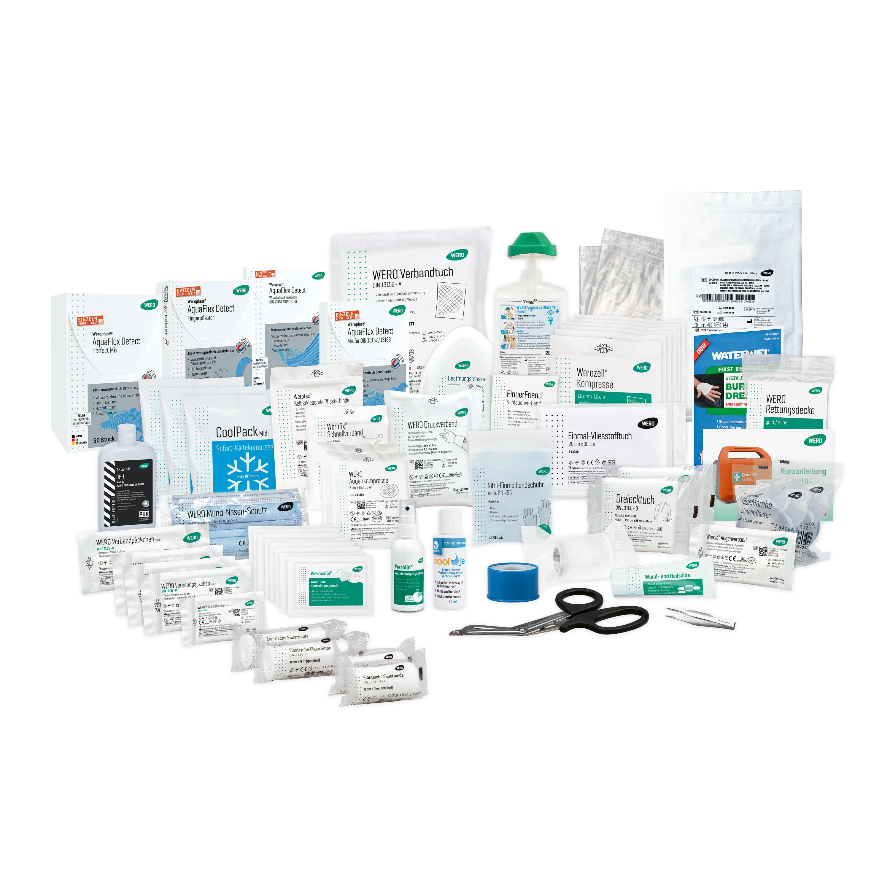 Füllung für Erste Hilfe Koffer Lebensmittelverarbeitung bestehend aus Pflastern, Verbandmaterial, Schere, Spray und weiteren Verbandmitteln.
