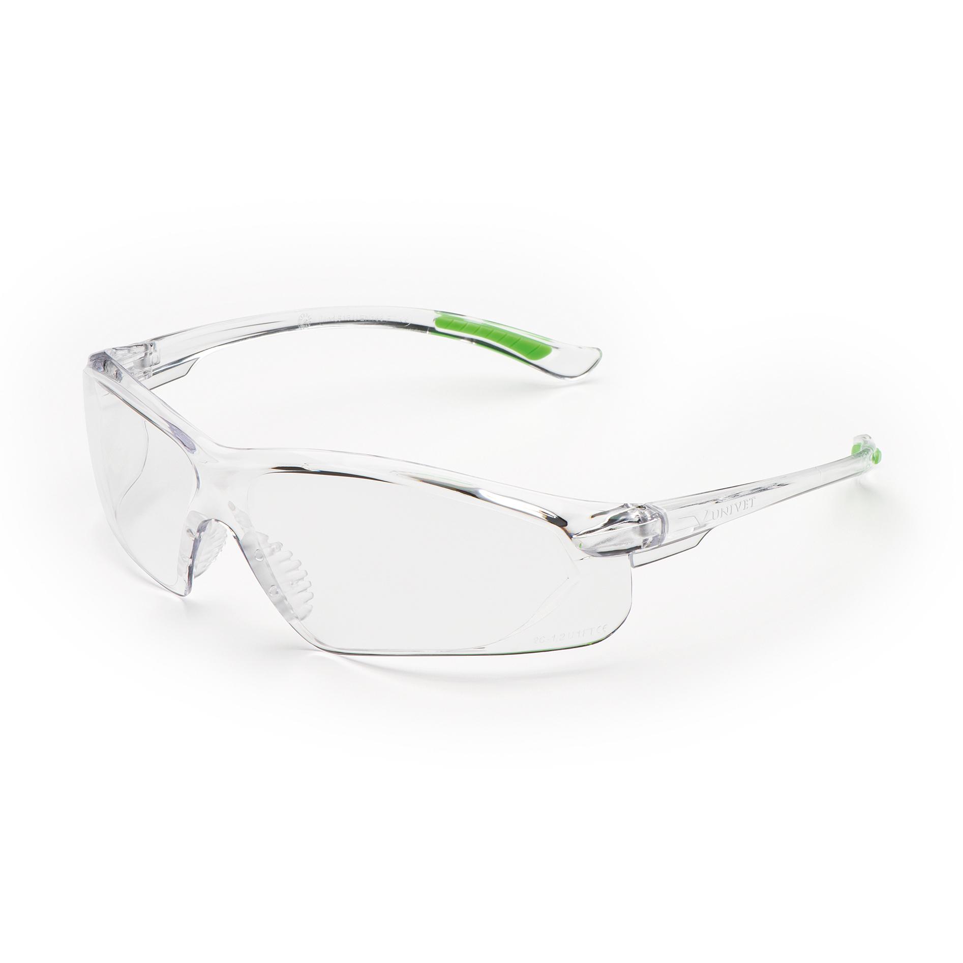 Die Arbeitsschutzbrille Racy Top - Transparent mit durchsichtig getönten Gläsern und grünem Nasensteg liegt leicht schräg nach links.