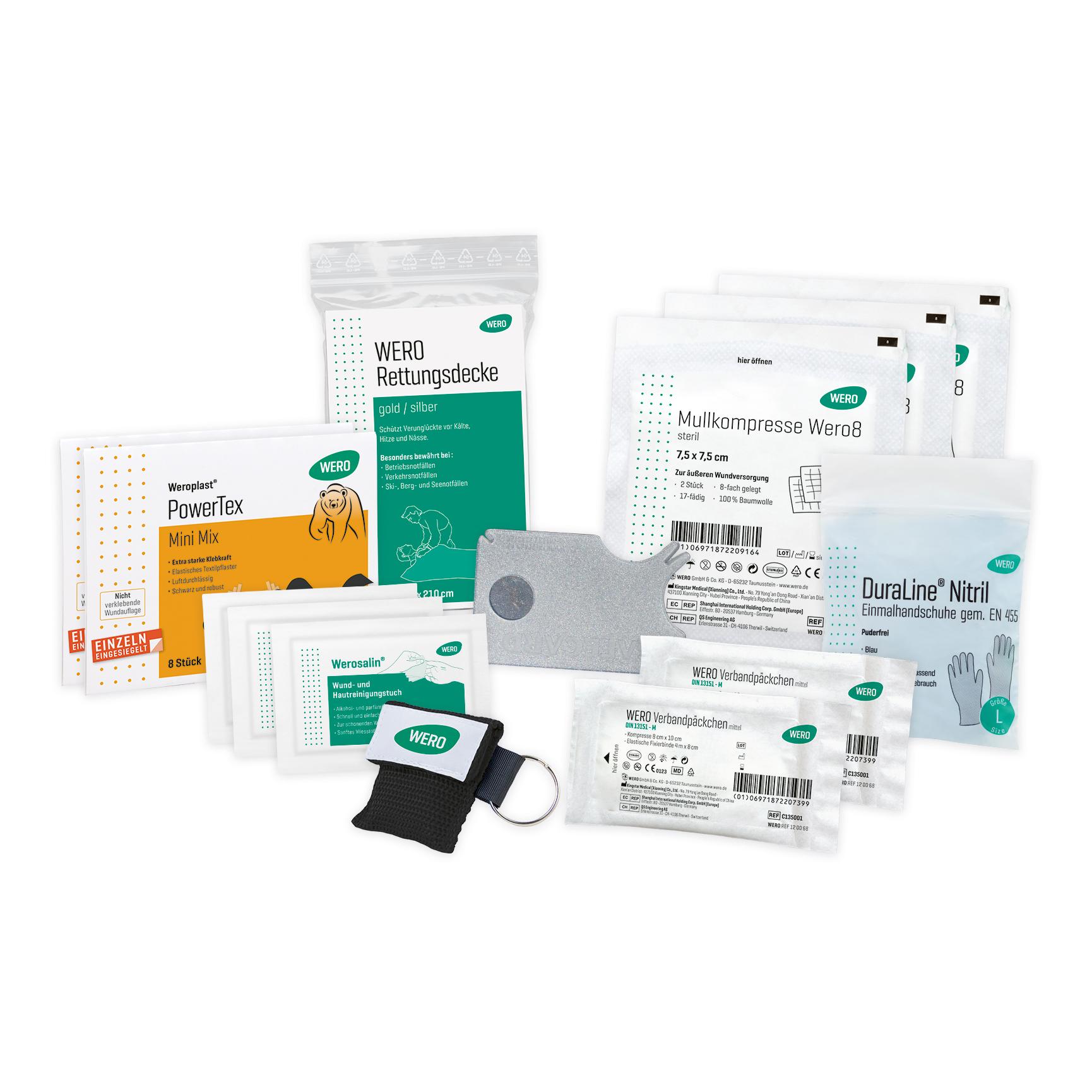 Diverse medizinische Utensilien aus der WERO Füllung OutdoorWork Erste Hilfe Tasche, darunter Verbandpäckchen, sterile Kompressen und Nitrilhandschuhe.